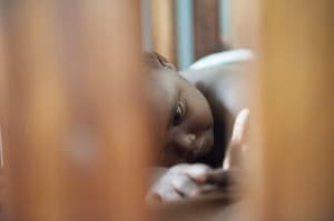 Orphaned Child resting, Gulu, Northern Uganda, Africa 0056